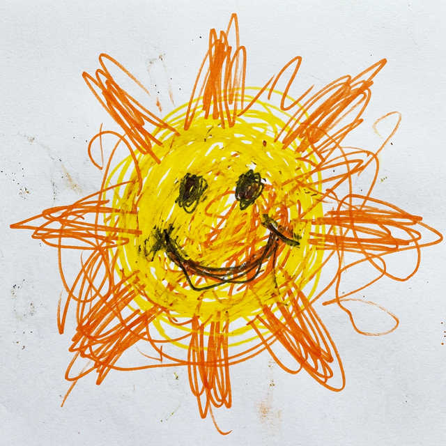 Messy child drawing of a sun